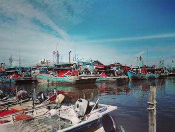 Boats moored at harbor