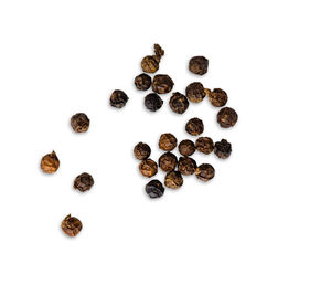 High angle view of coffee beans against white background