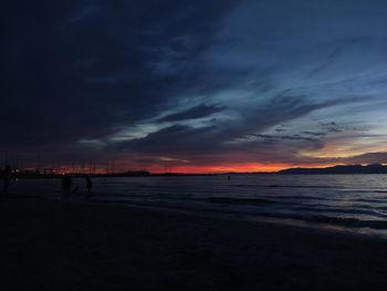 Scenic view of beach against sky during sunset