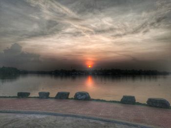 Scenic view of lake against sky during sunset