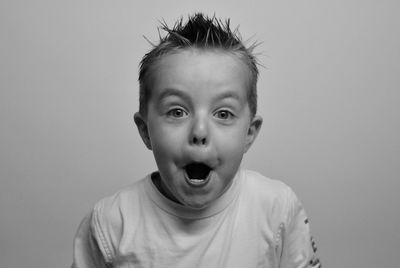 Portrait of boy against white background