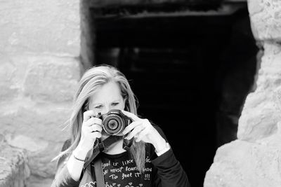 Midsection of child photographing