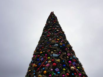 Low angle view of christmas tree against sky