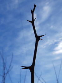 Low angle view of wind turbine against sky