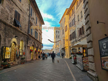 People walking on street in city