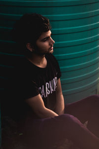 Side view of young man looking away