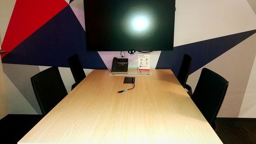 High angle view of illuminated electric lamp on table