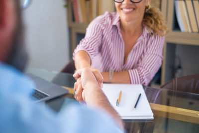 Midsection of man working at office