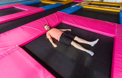 High angle view of woman lying on floor