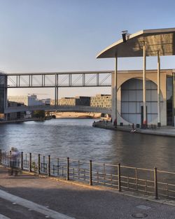 View of bridge over river in city