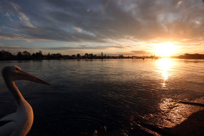 Scenic view of lake against sky during sunset