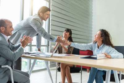 Business colleagues working at office