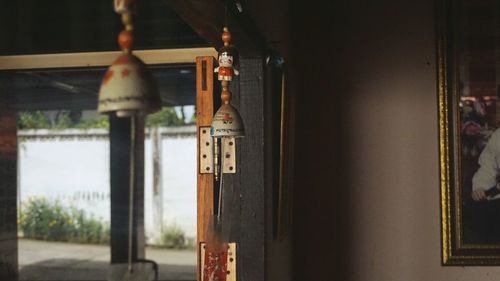 Close-up of metal hanging outside building