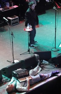 Man playing guitar at music concert