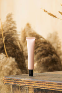 Pink tube of anti-aging cosmetic, moisturizing cream for the skin around the eyes 