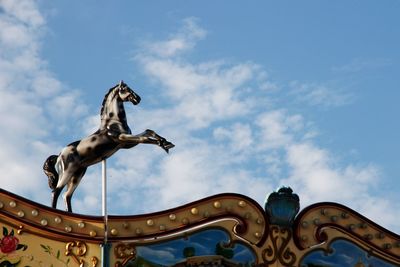 Low angle view of statue against sky