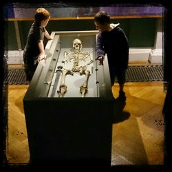 High angle view of people standing on table