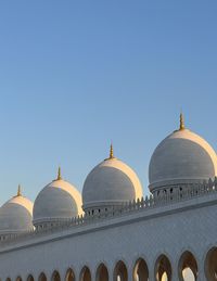 Low angle view of mosque against clear sky