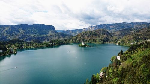 Scenic view of lake and mountains against sky