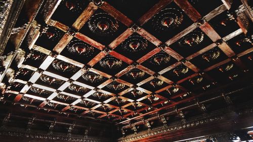 Low angle view of illuminated ceiling