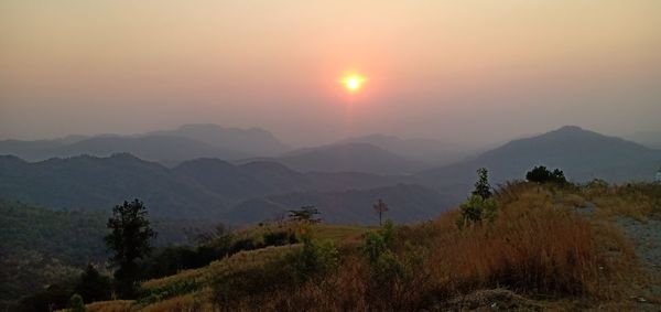 Scenic view of mountains against sky during sunset