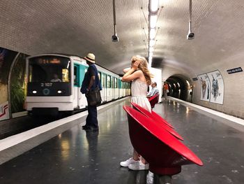 Woman standing in train