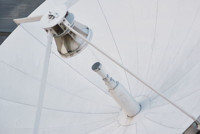 High angle view of telephone on table against white wall