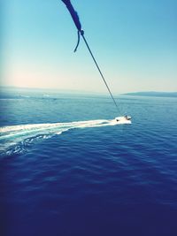 Scenic view of sea against clear blue sky