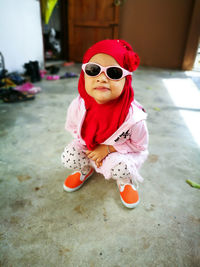 Portrait of cute girl wearing sunglasses