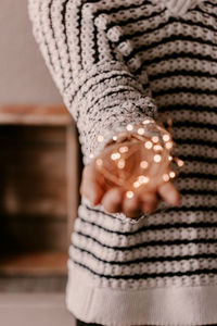 Close-up of woman with hand