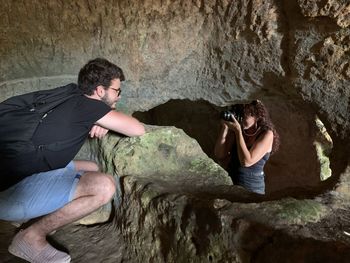 Young couple kissing in cave