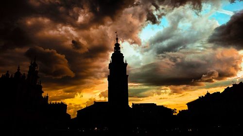 Low angle view of tower against cloudy sky