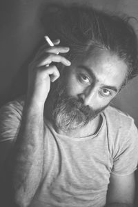 Portrait of man smoking cigarette