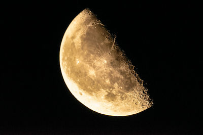 Low angle view of moon against sky at night