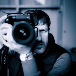 Close-up of man photographing