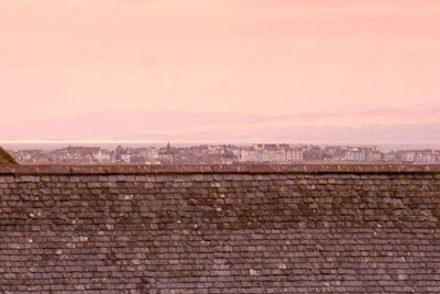 Brick wall against sky