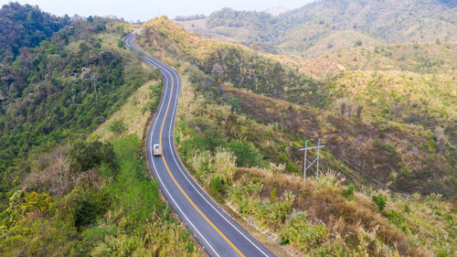 High angle view of road amidst mountains