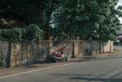 Man riding motor scooter on street