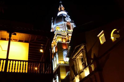 Low angle view of illuminated building at night