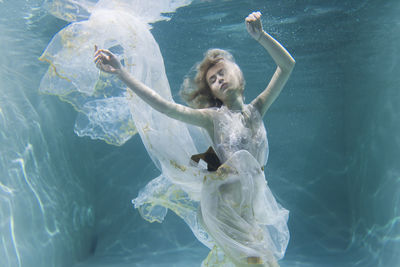 Woman swimming in sea