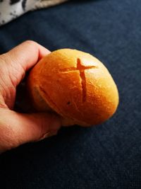 Close-up of hand holding orange