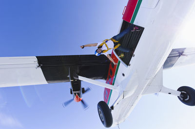 Low angle view of airplane flying in sky