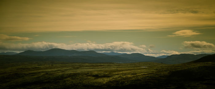 Scenic view of landscape against sky during sunset