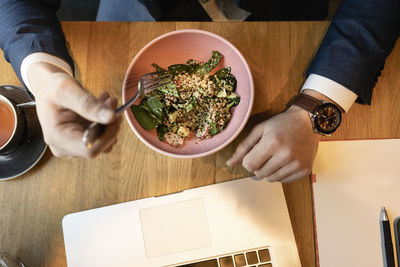 High angle view of man preparing food on table