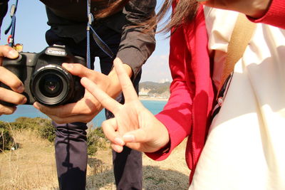 Cropped image of woman holding hands