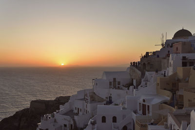 Buildings against sky during sunset