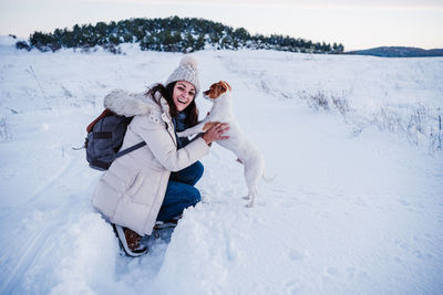 Woman on snow covered field