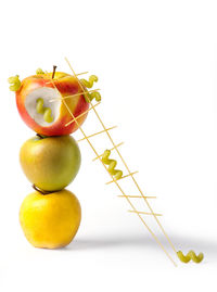 Close-up of fruits against white background