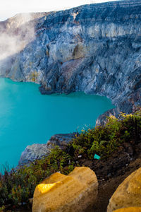 High angle view of rocks by lake