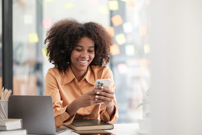 Young woman using mobile phone